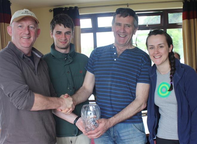 Commodore Tom Murray presenting the trophy for the ’Best Foynes Boat’ to Vincent McCormack skipper of Three Chevrons with crew Luke & Roisin McCormack © Irish Sailing Association . http://www.sailing.ie